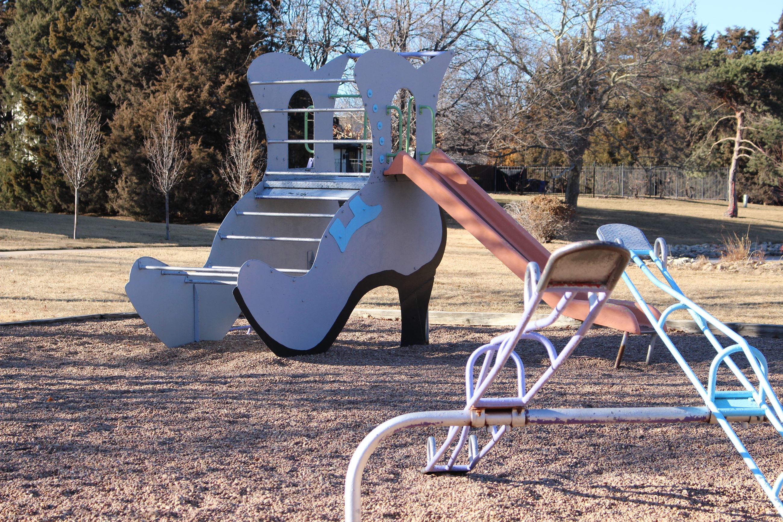 Countryside Park features a slide that looks like a shoe, which sits next to a merry-go-round