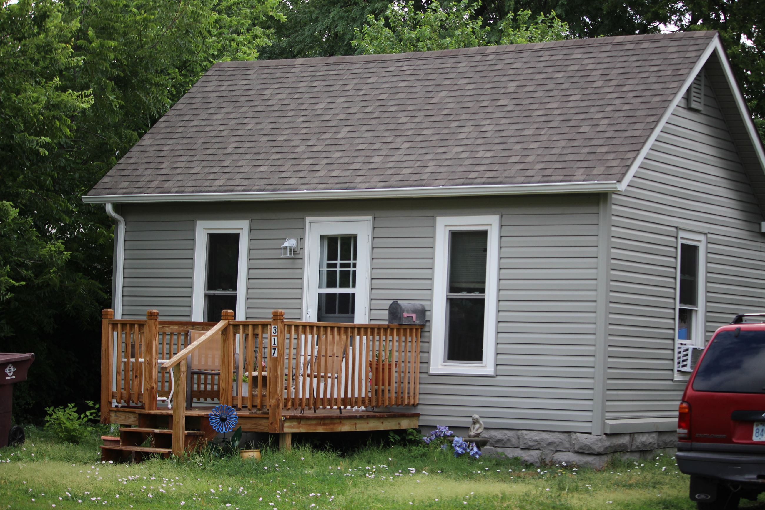 Remodeled one story home with tan siding
