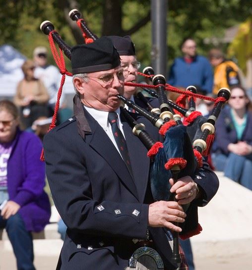 Man playing bagpipes.